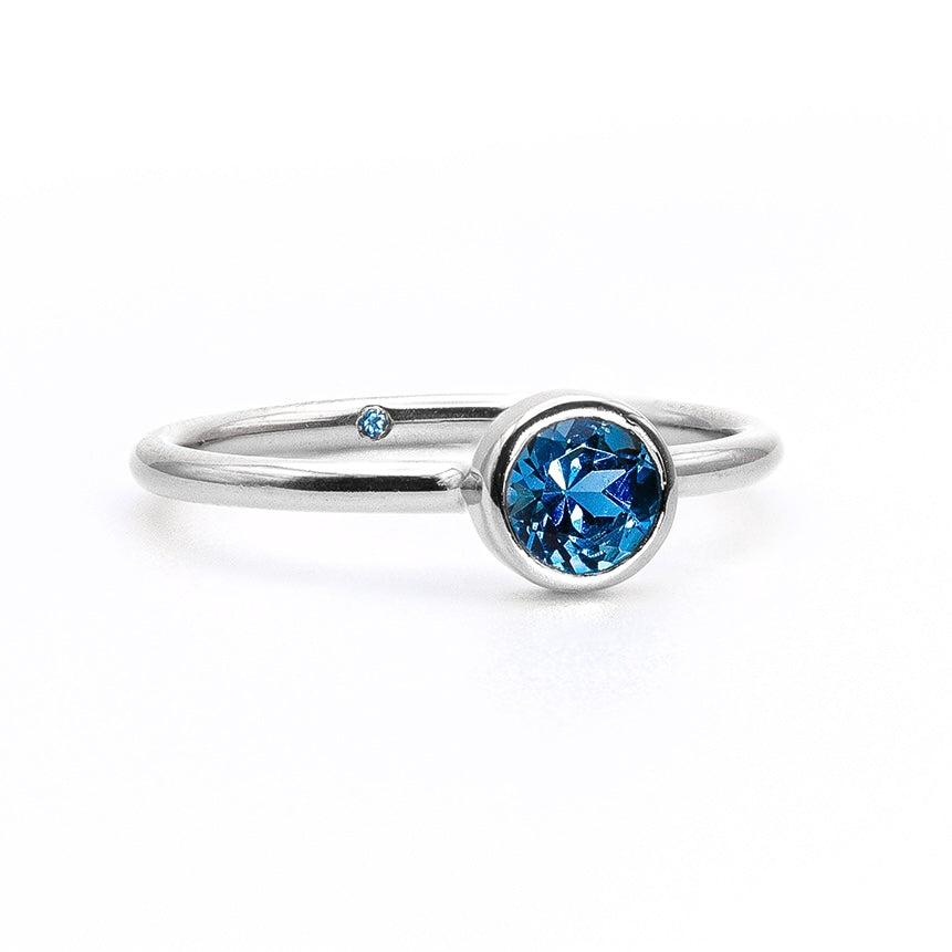 Empowered Solitaire Blue Topaz Ring