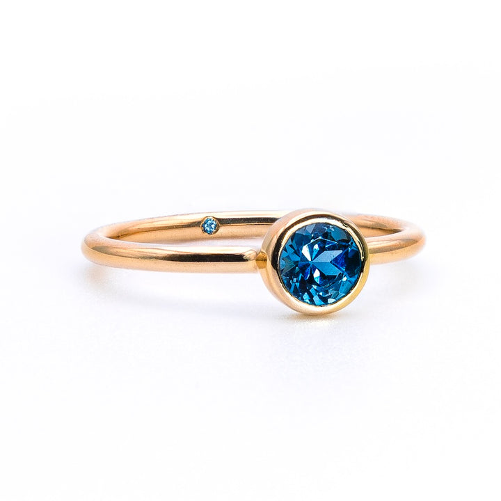 Empowered Solitaire Blue Topaz Ring