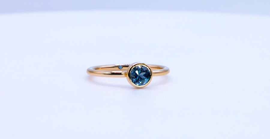 Empowered Solitaire Blue Topaz Ring